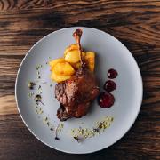 Duck confit with apples and peaches caramel