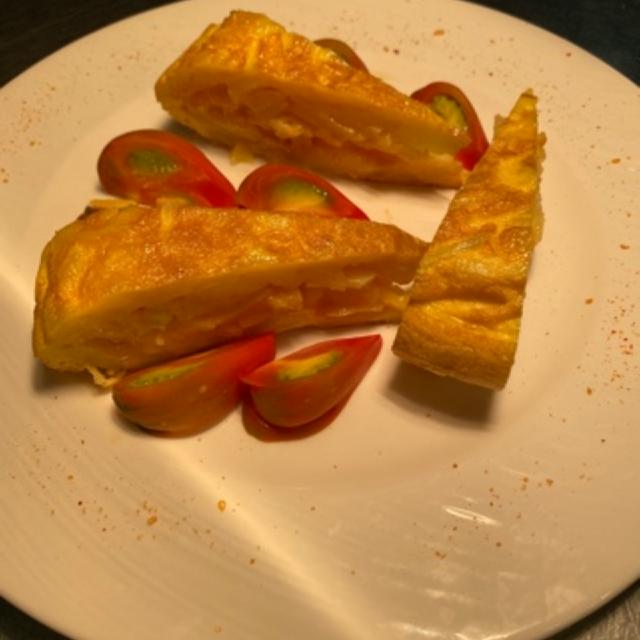 Potato omelet with tomato Rosa