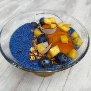 Coconut milk chia pudding "Saltea" from blue spirulina with seasonal fruits and homemade granola