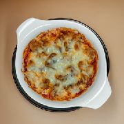 Запечена грудинка зі свинини під сирною скоринкою